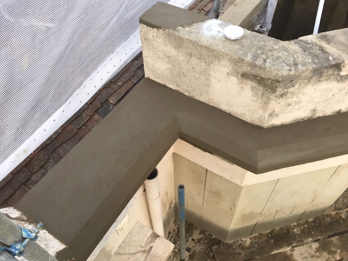 Render repair work in progress at Withersdane Hall
